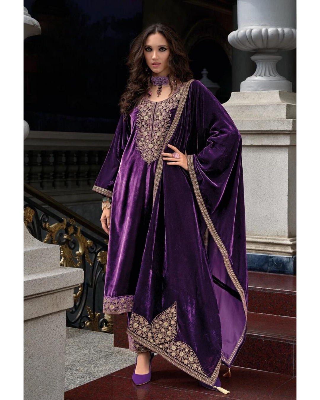 Woman wearing Masnavi Makhmali premium Russian velvet embroidered kurta suit set in Violet with zari dupatta