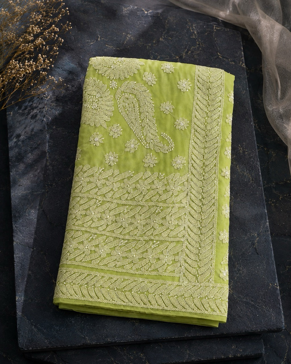 Green Georgette Ready to Wear Chikankari Saree, Naaz Collection by Masnavi, folded flat lay, still life.