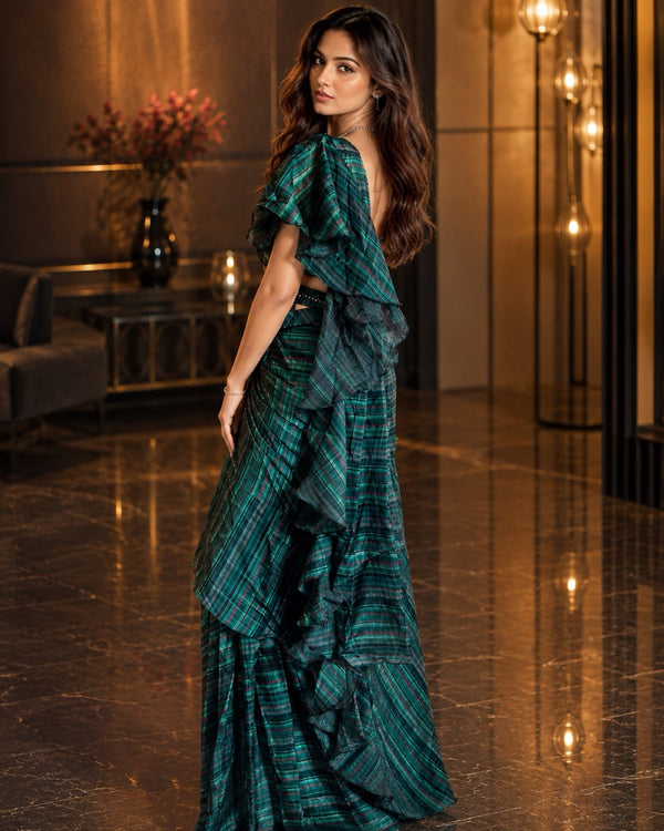 Green Organza Ready to Wear Saree from the Shokhi collection by Masnavi, modelled by a woman, side view
