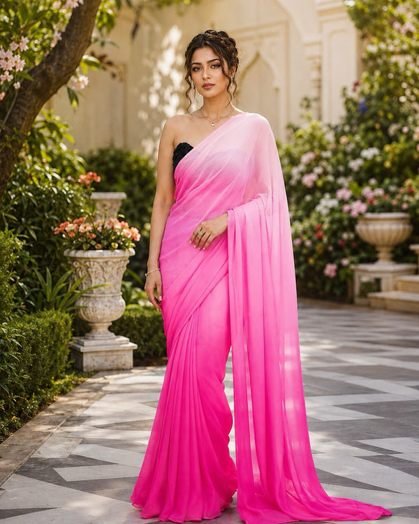 Rani Ombré Pink Ready to Wear Chiffon Saree by Masnavi, modelled by a woman in a garden courtyard, front view