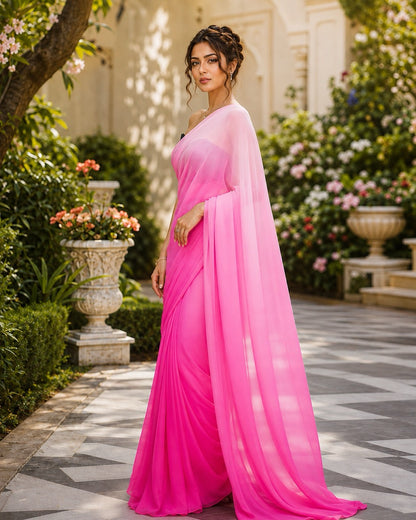 Rani Ombré Pink Ready to Wear Chiffon Saree by Masnavi, modelled by a woman in a garden courtyard, side view