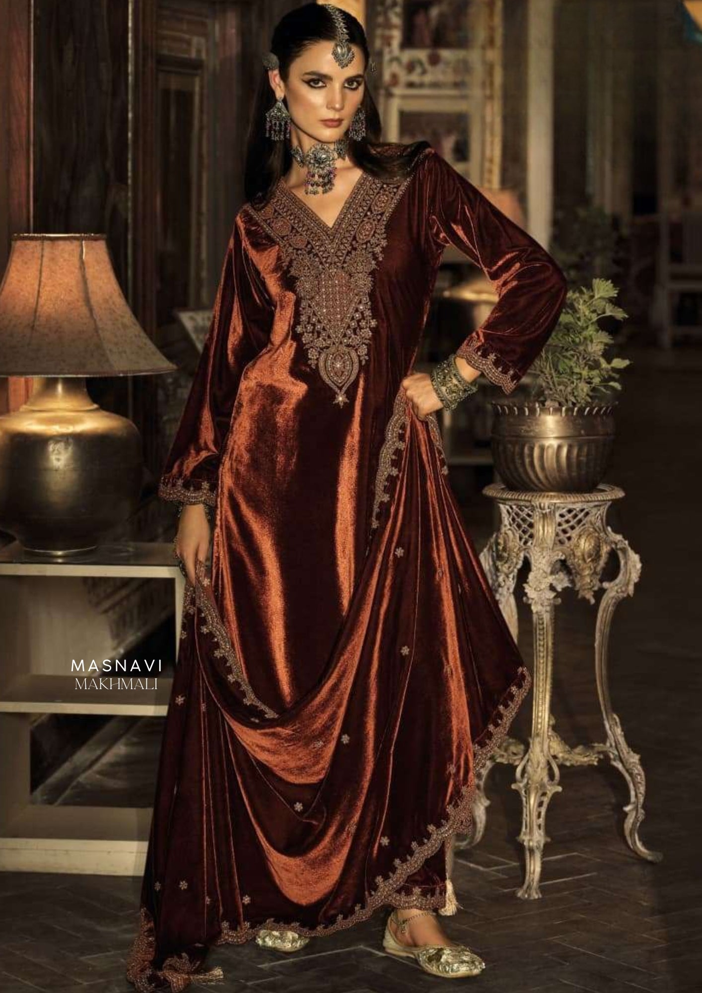 Woman in Shah-e-Zamana Makhmali Embroidered Velvet Suit Set in Bronze with Scalloped Zari Dupatta & Straight Trousers
