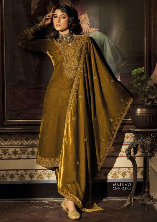 Woman in Zarafshan Makhmali Embroidered Velvet Suit Set in Antique Gold with Scalloped Zari Dupatta & Straight Trousers