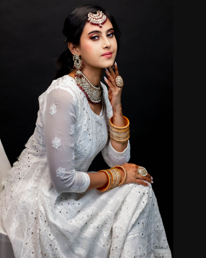 Premium chikankari suit set with allover mukaish and chikankari embroidery.